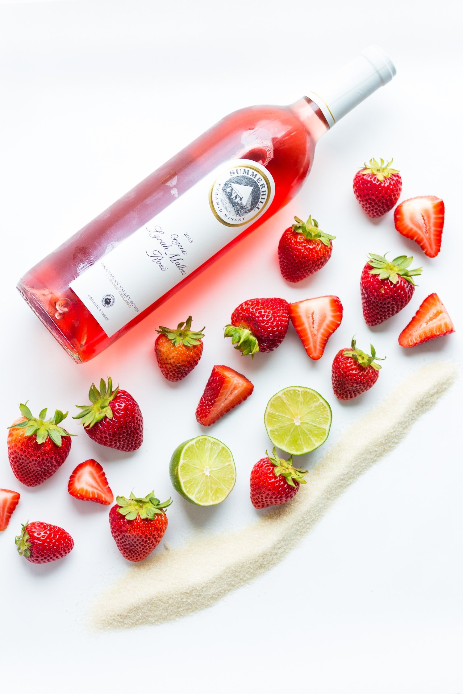 Strawberry Frosé ingredients on a white background.