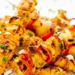 Pile of grilled tandoori chicken kebabs.