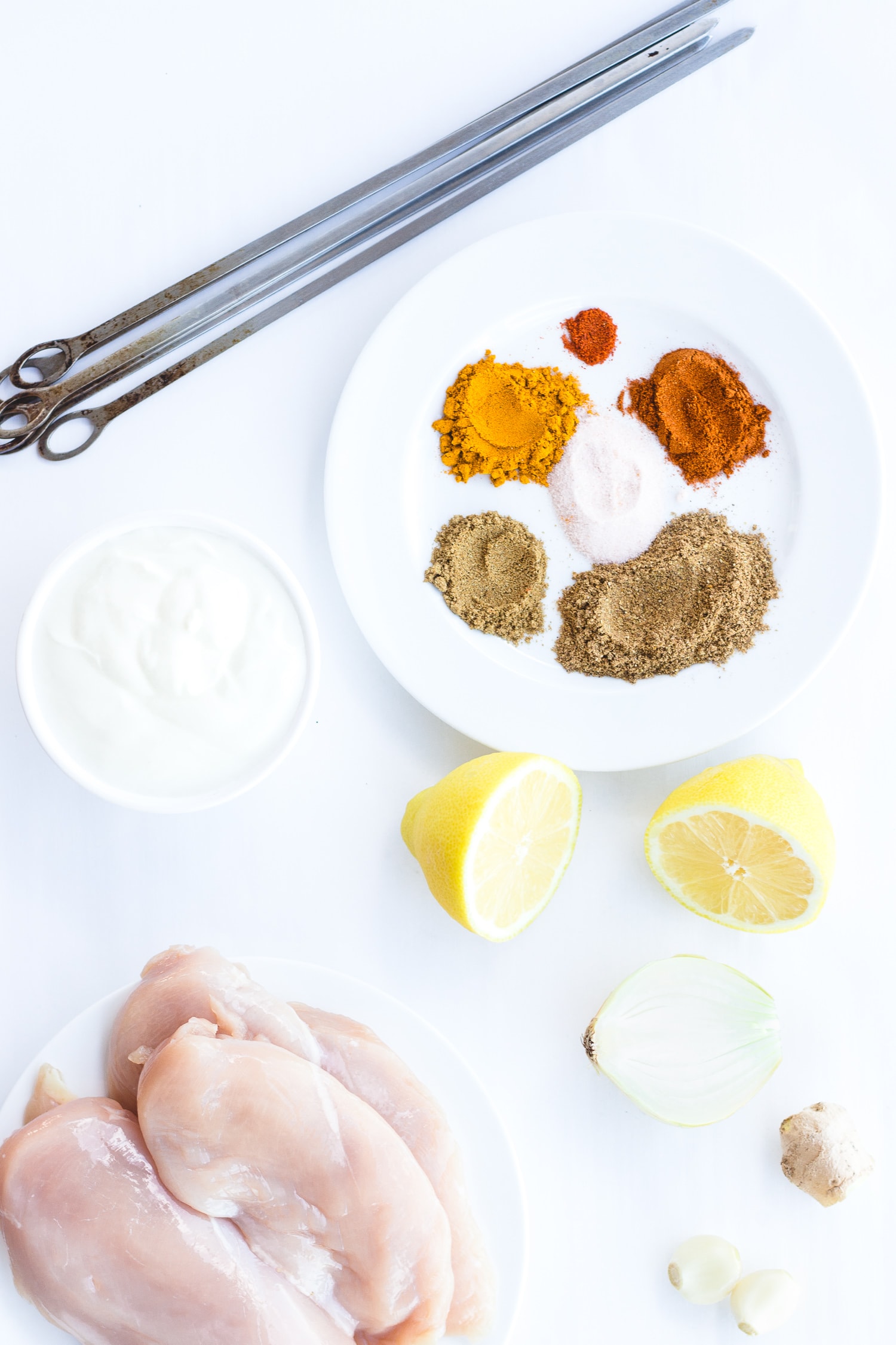 Overhead shot of ingredients needed for grilled tandoori chicken kebabs