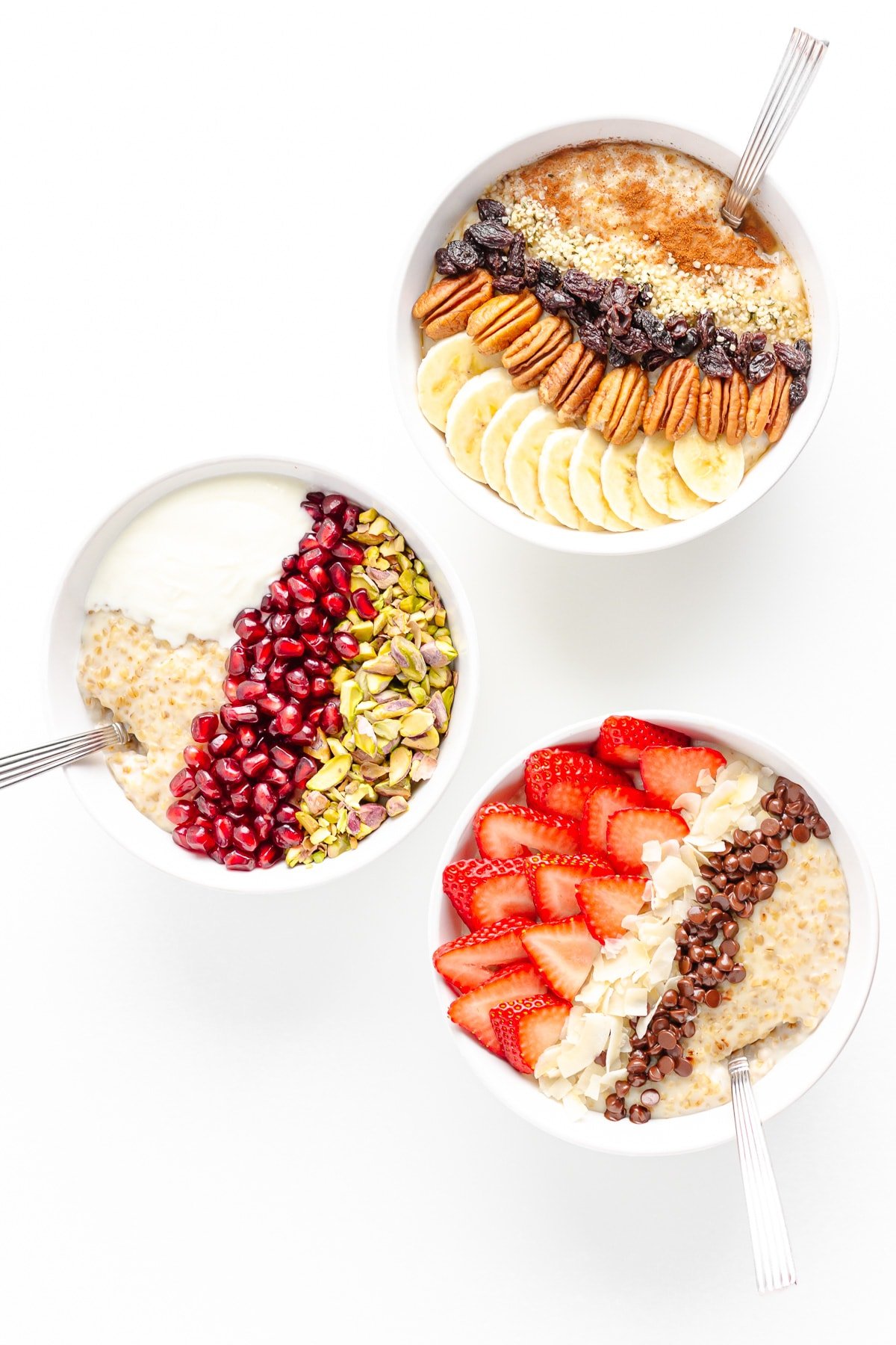 Three bowls of steel cuts oats with different toppings on a white background.