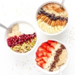 Three bowls of steel cut oats with different toppings on each bowl.
