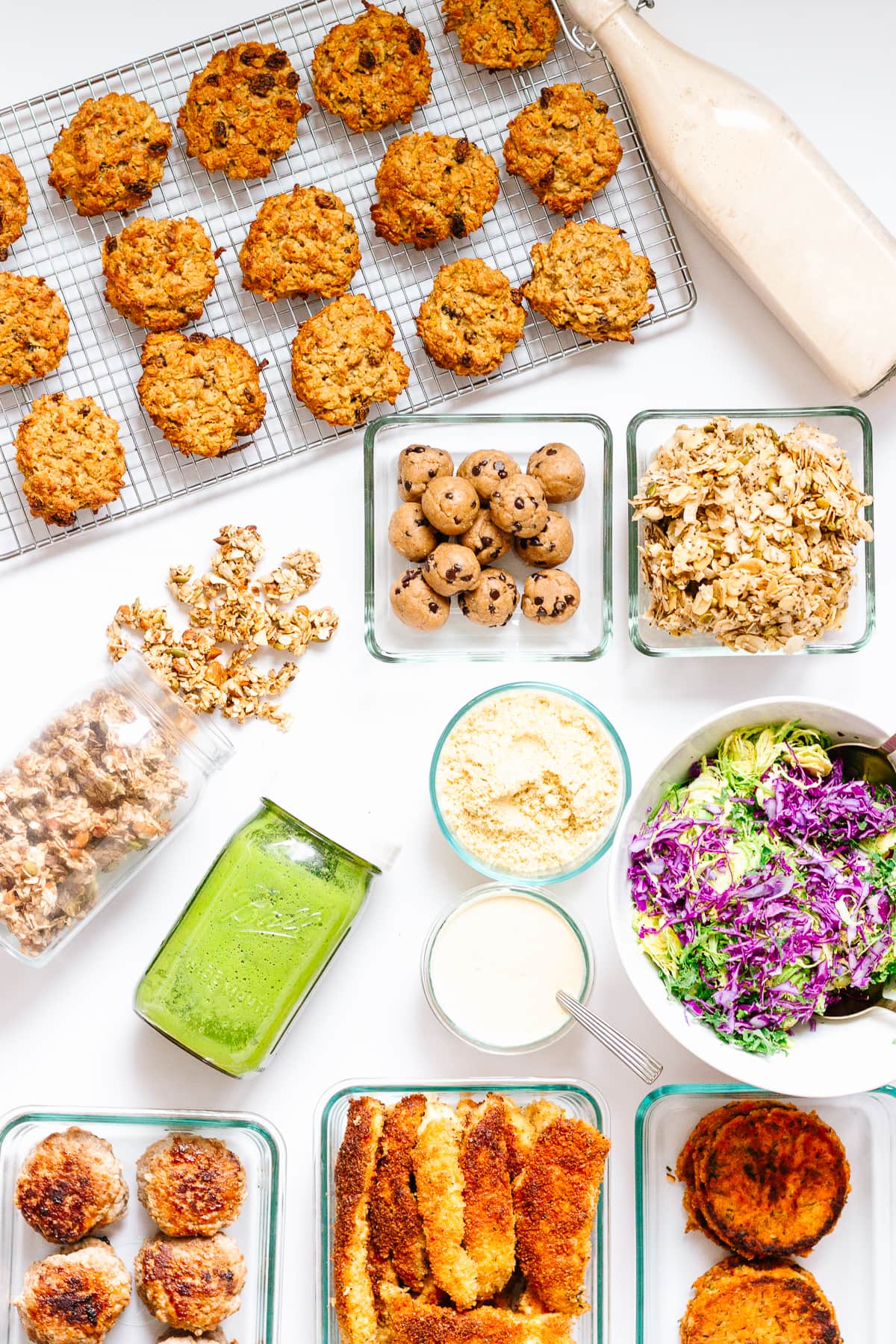 Top down photo of a variety of recipes meal prepped from The HealthNut Cookbook