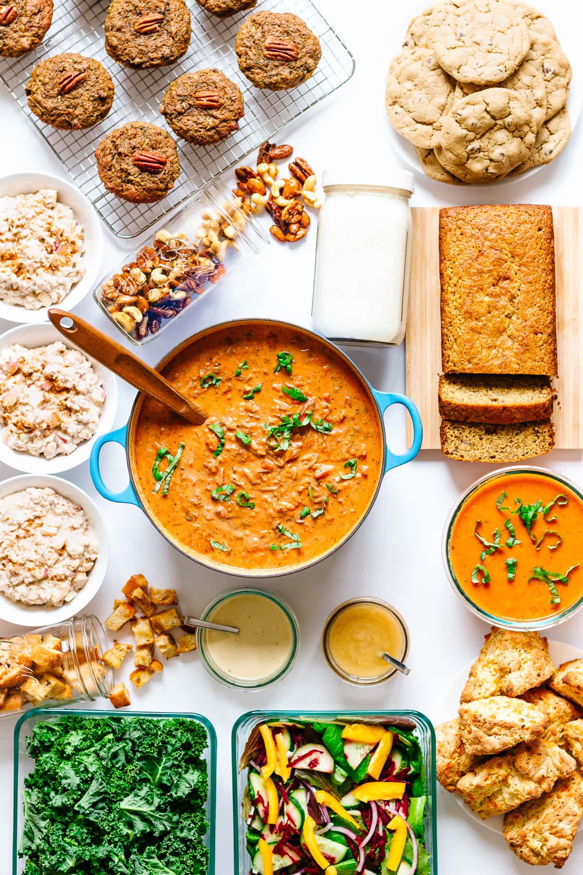 Overhead photo of a meal prep featuring comfort food and snack food recipes.