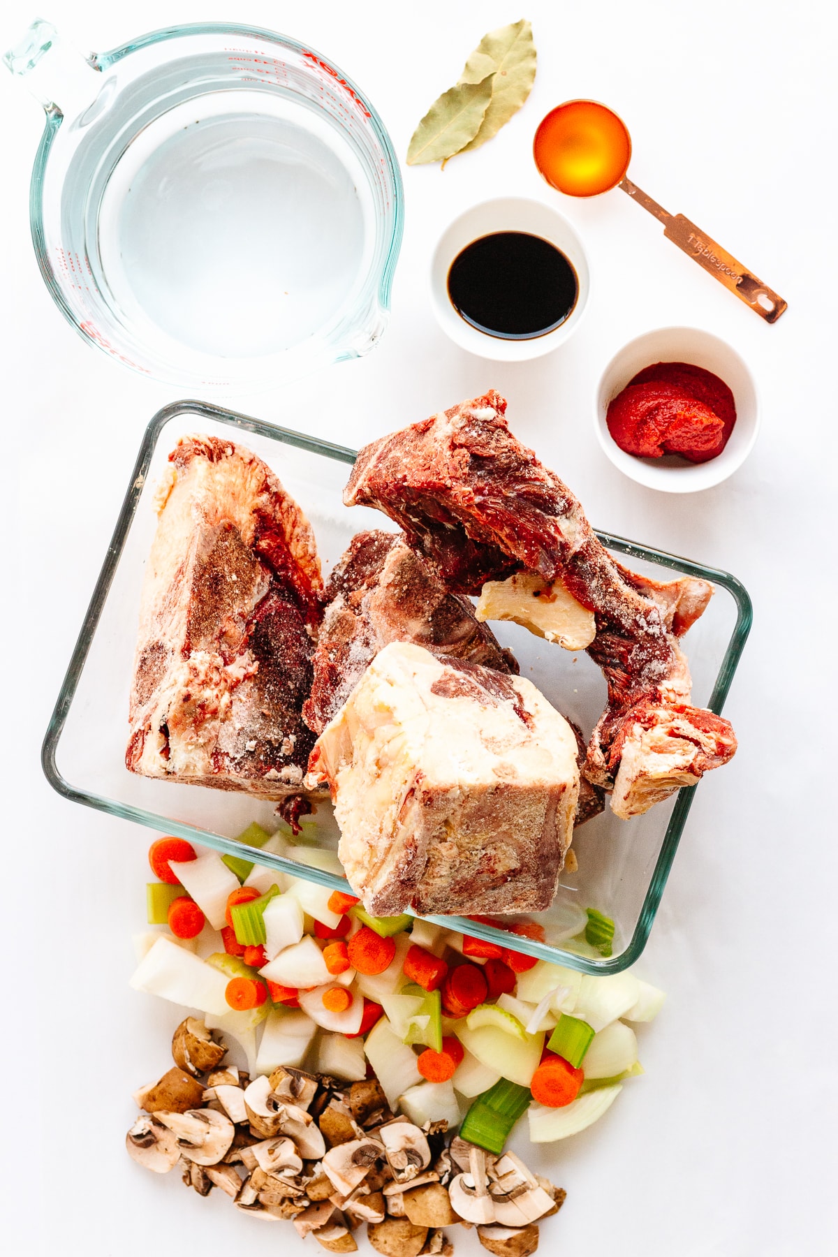 Overhead photo of the ingredients needed to make beef bone broth or stock.