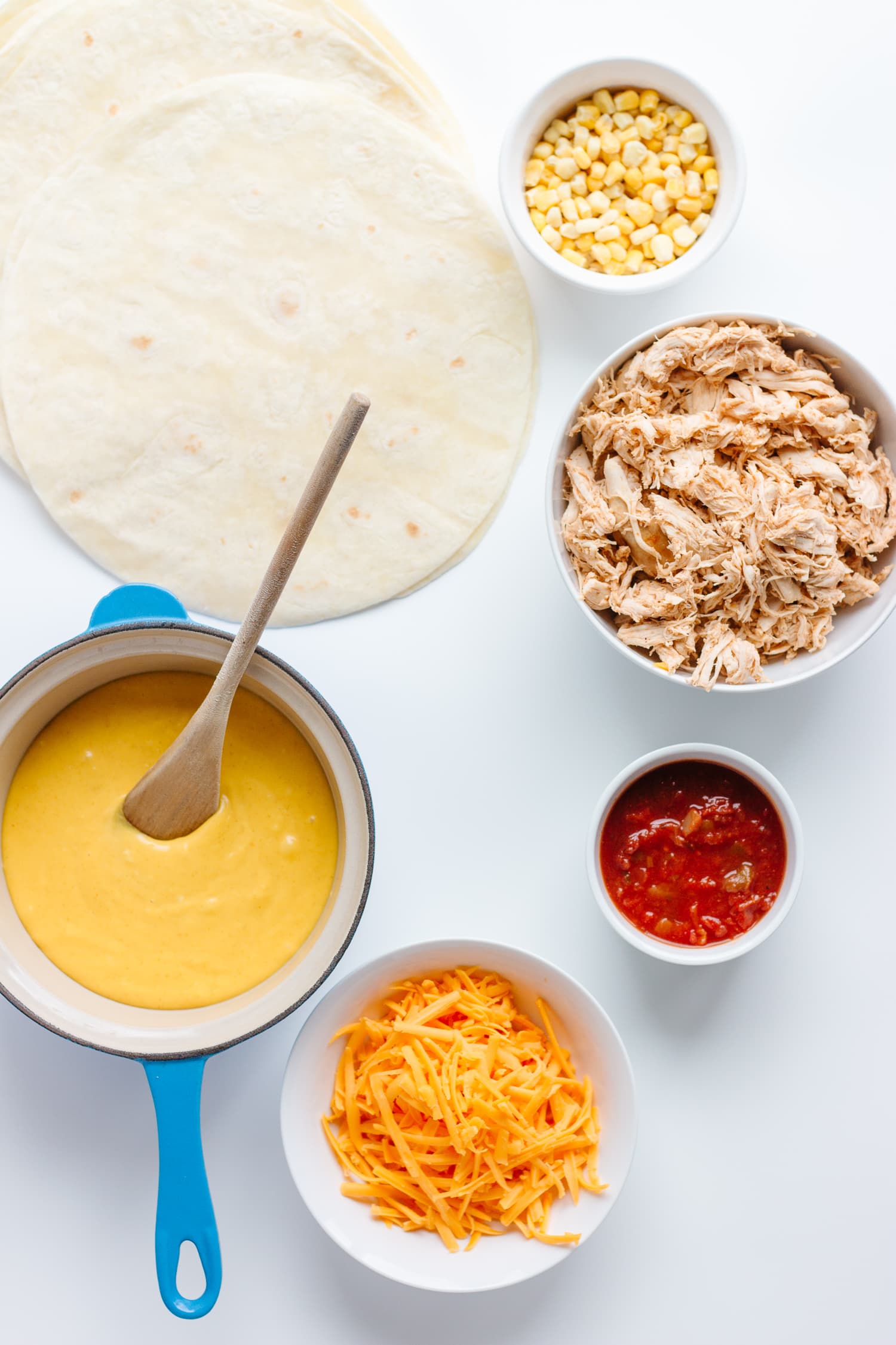 Overhead photo of ingredients needed to make this Cheesy Chicken Enchiladas recipe.