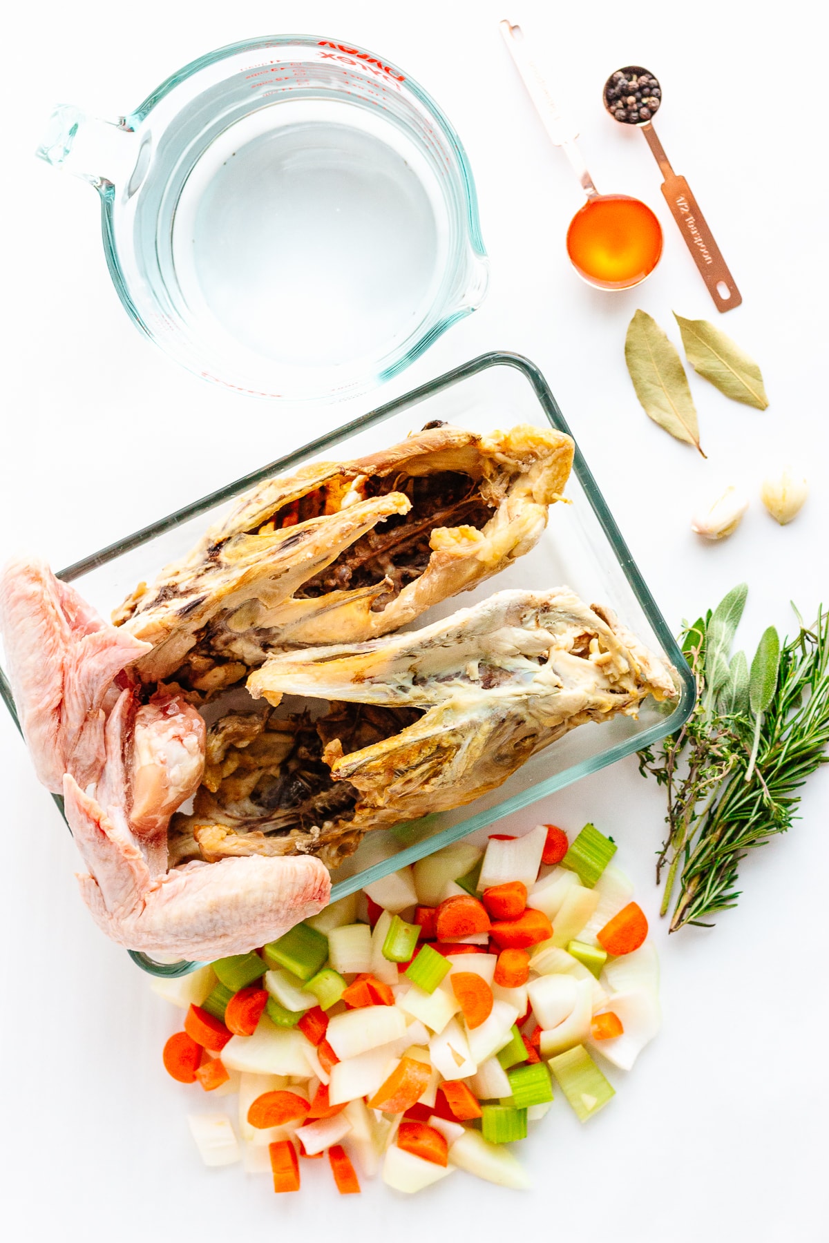 Overhead shot of all the ingredients needed to make chicken bone broth (stock)