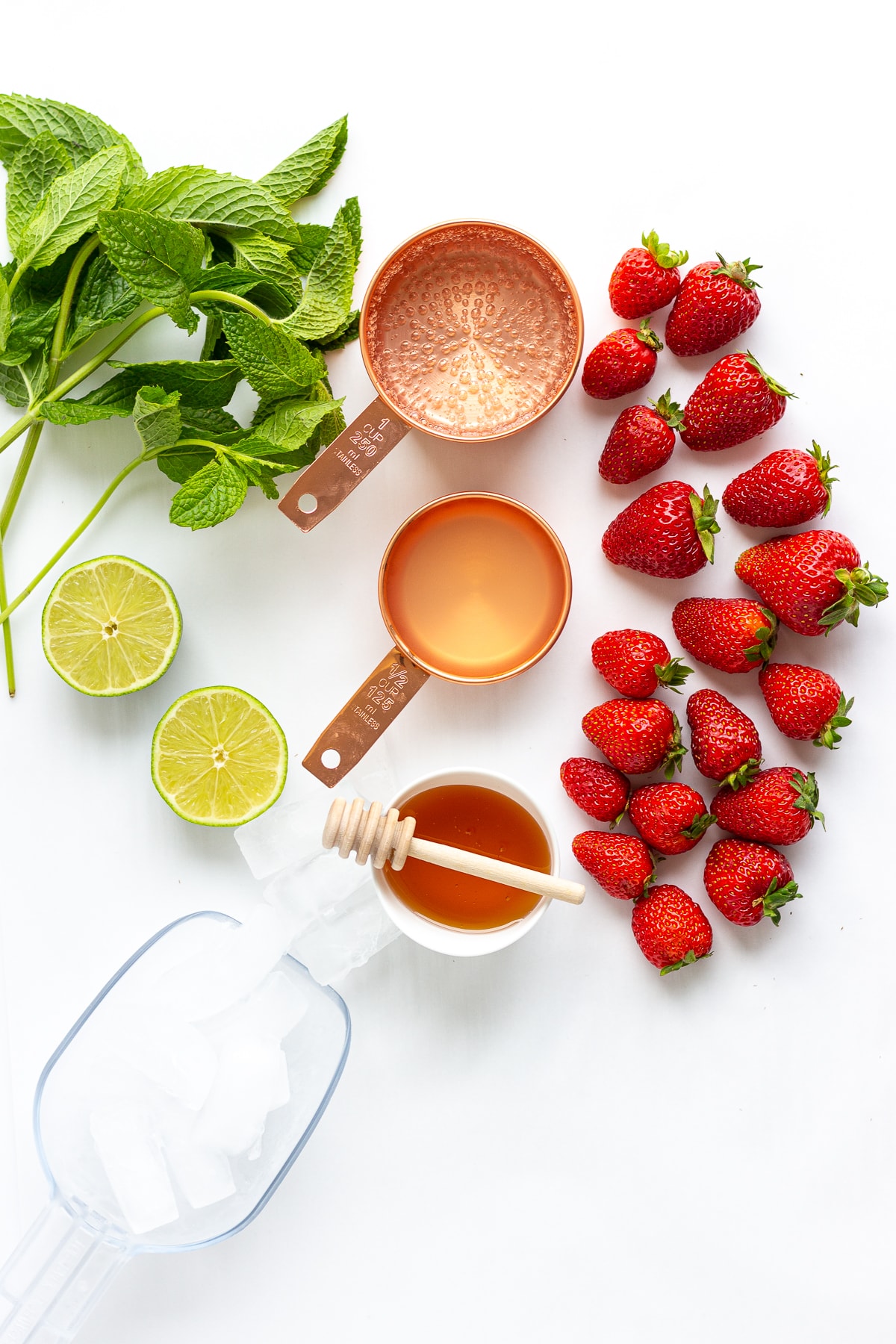 Overhead photo of all the ingredients needed to make Strawberry Mojito Mocktails.