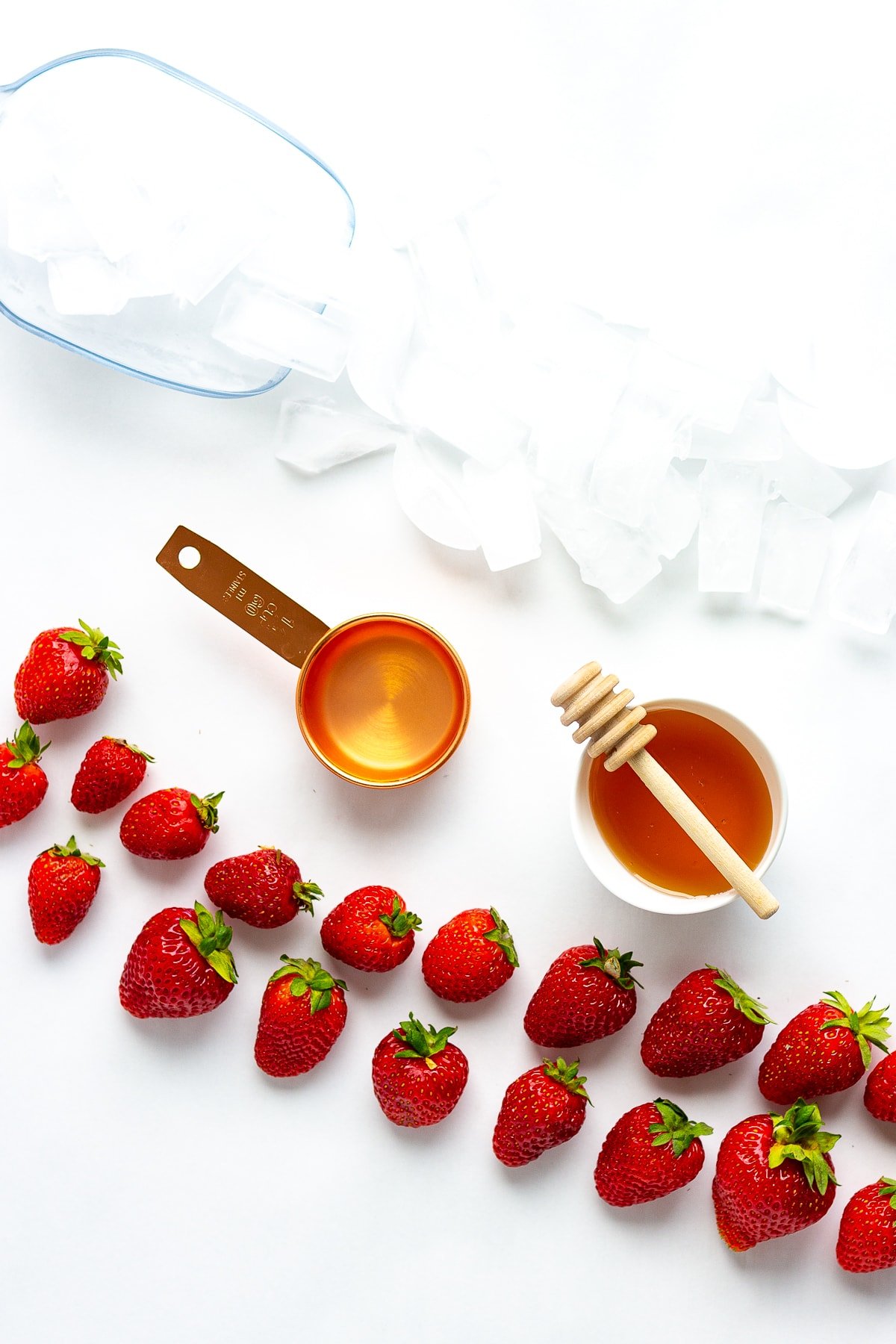 Overhead photo of the ingredients needed to make a homemade strawberry slushie.