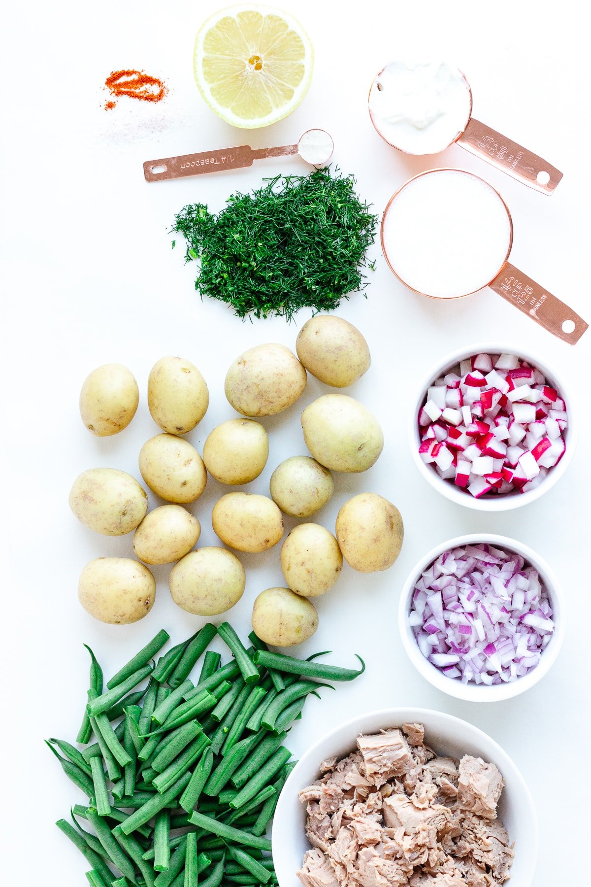 Overhead photo of ingredients needed to make tuna potato salad with dill buttermilk dressing.
