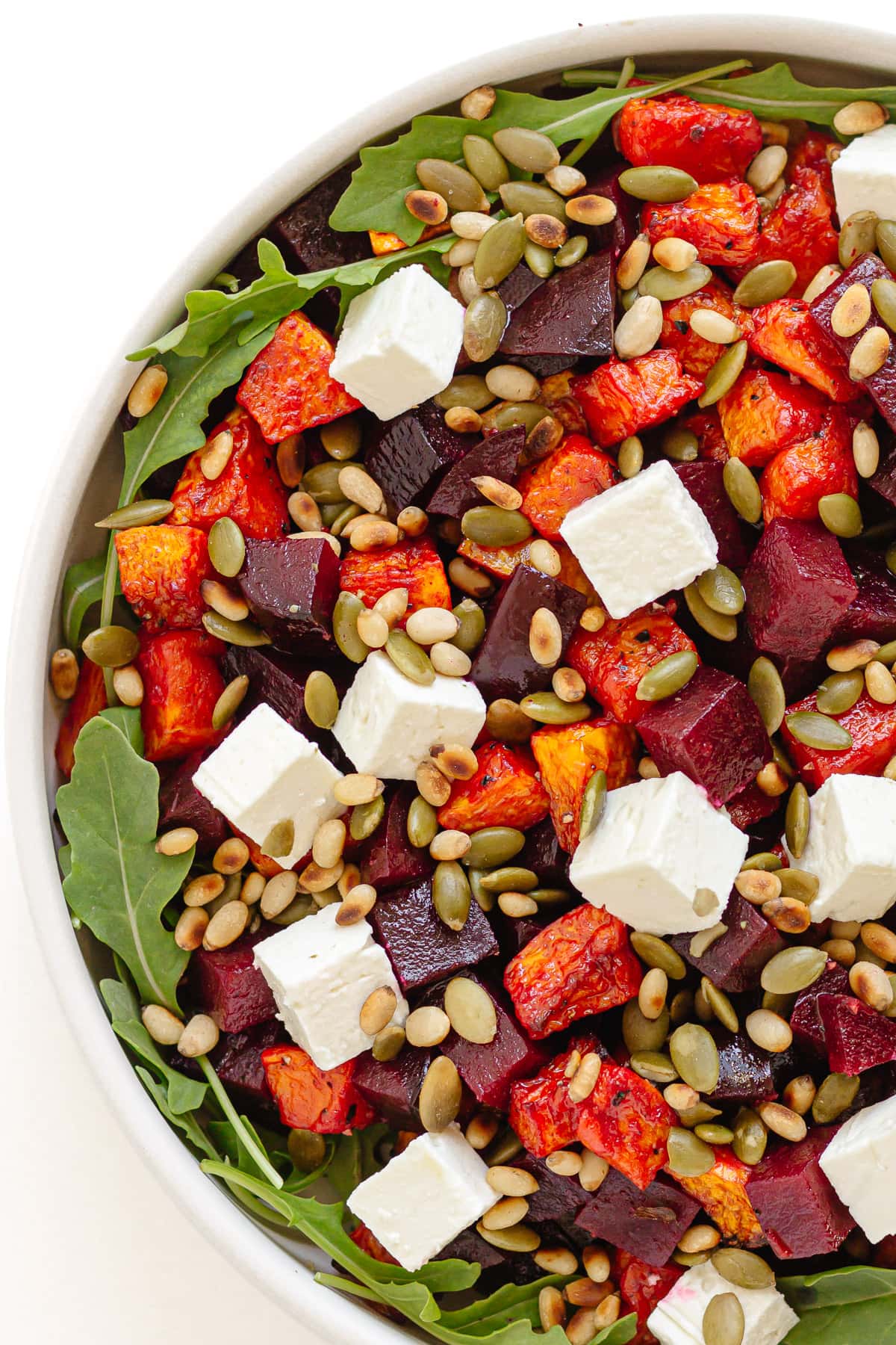 Roast pumpkin and beet salad in a serving bowl.