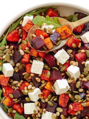 Serving bowl of salad with roasted pumpkin, beetroot and feta.