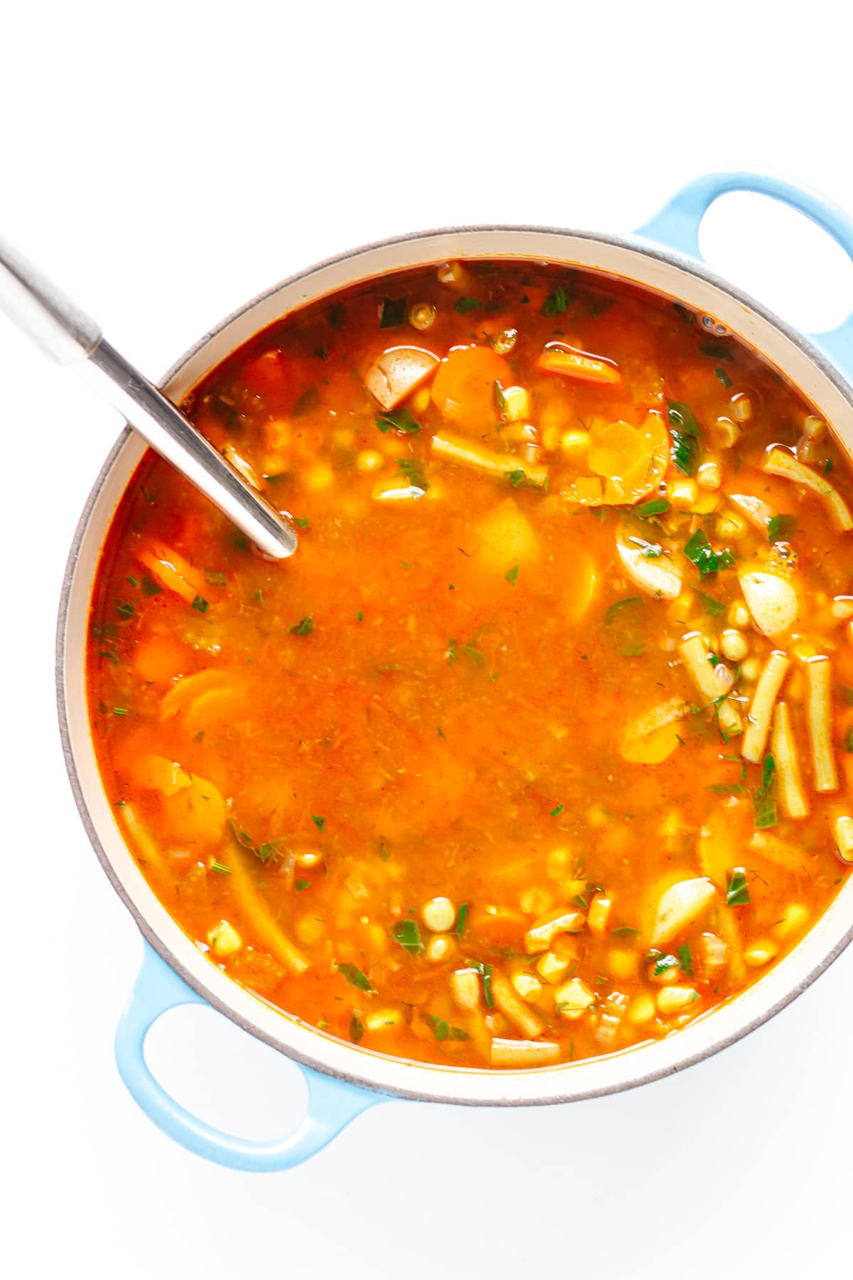 Overhead view of vegetable soup in dutch oven.