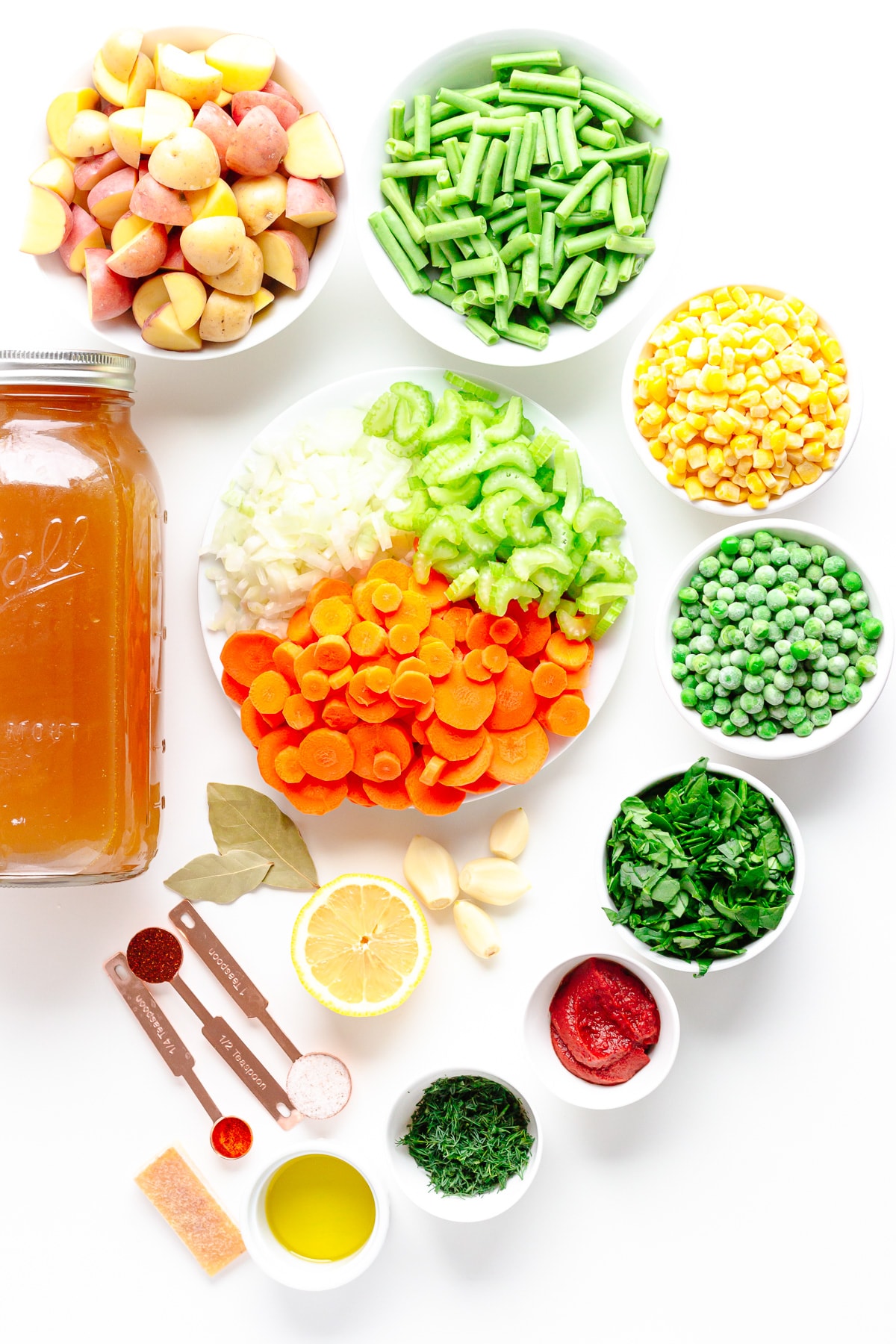 Flat lay photo of vegetable soup ingredients.