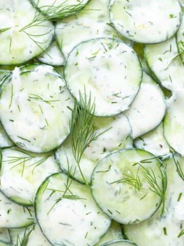 Close up of cucumber yogurt salad with dill.