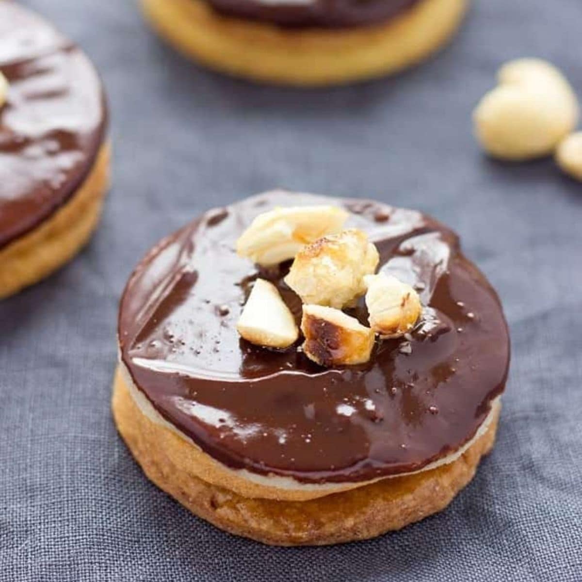 Closeup of a Hausfreunde German cookie with caramelised cashews on top.