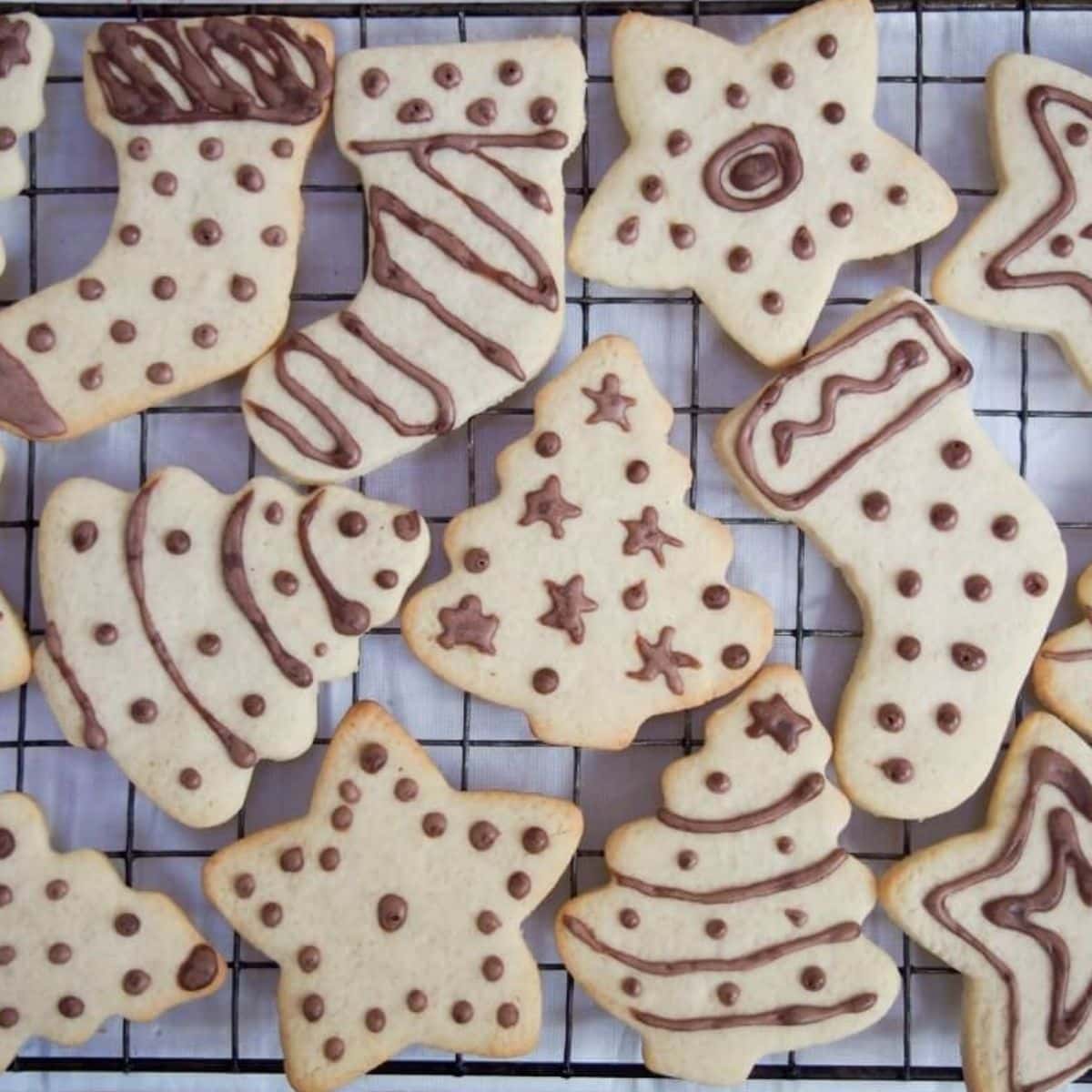 Variety of Ingwerplatchen (German Ginger Cookies) on a cooling rack.