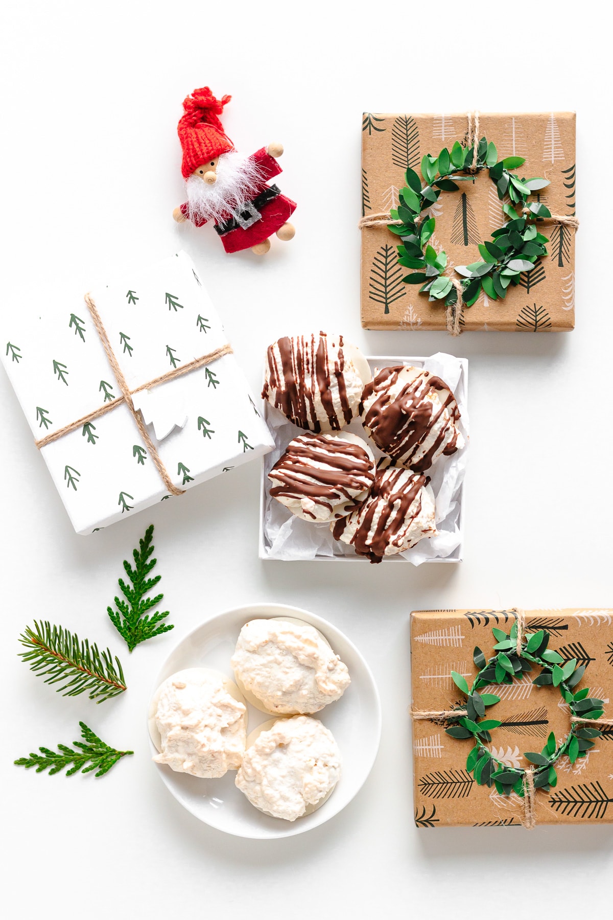 Christmas themed flatlay featuring regular German Coconut Macaroons and chocolate drizzled.