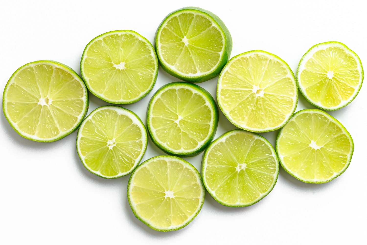 Lime slices on a white background.