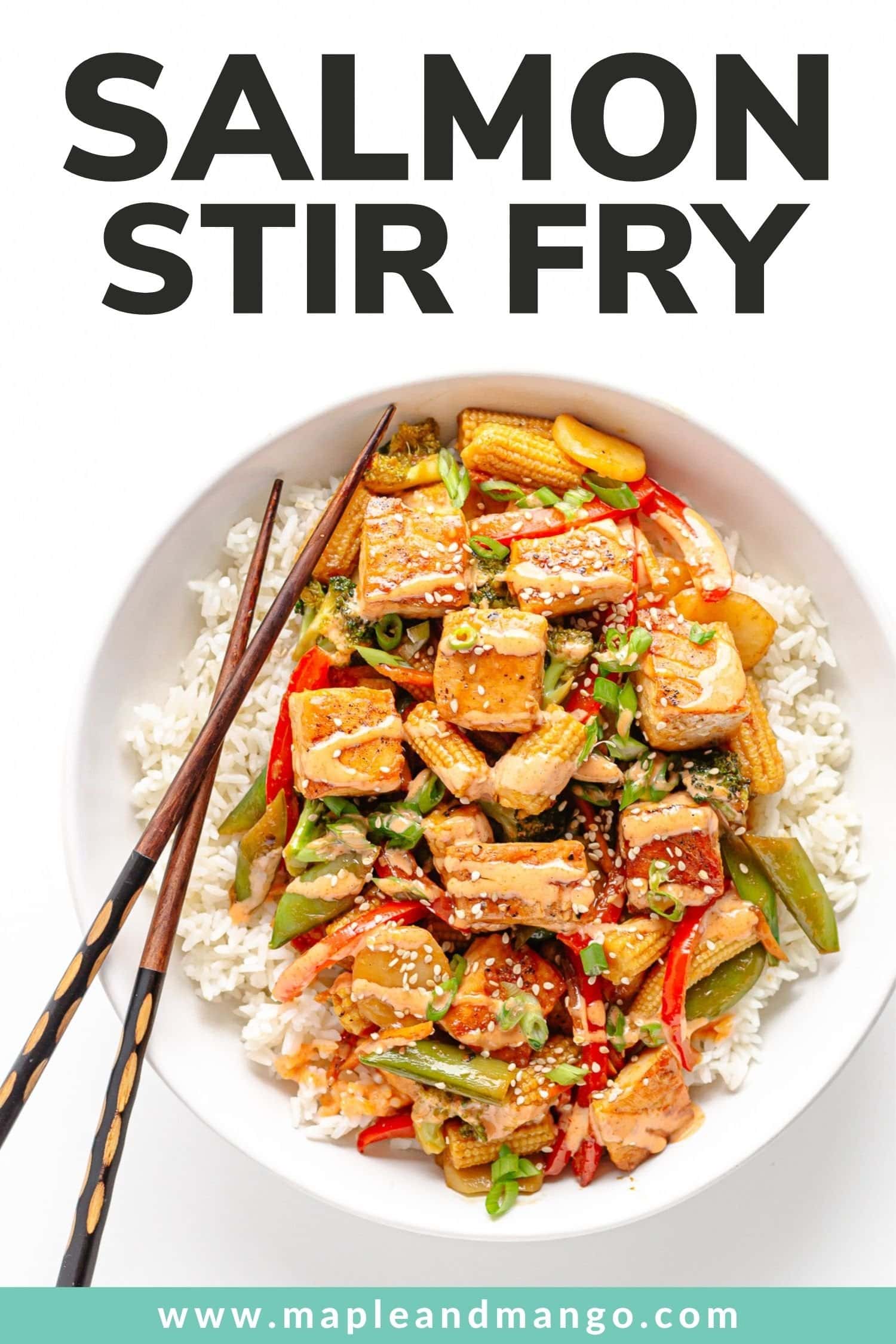 White bowl of stir fry served over rice with chopsticks on the side and text overlay on top that reads "Salmon Stir Fry".