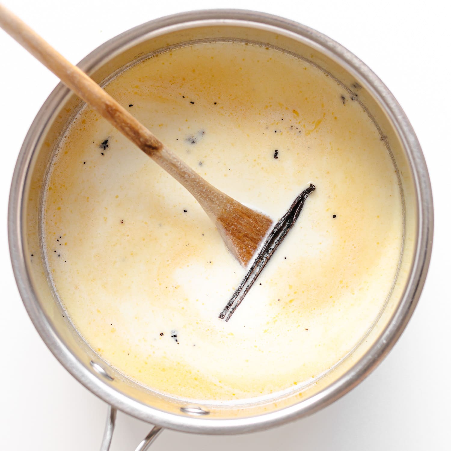 Stainless steel saucepan filled with all the ingredients for Milchreis before simmering.