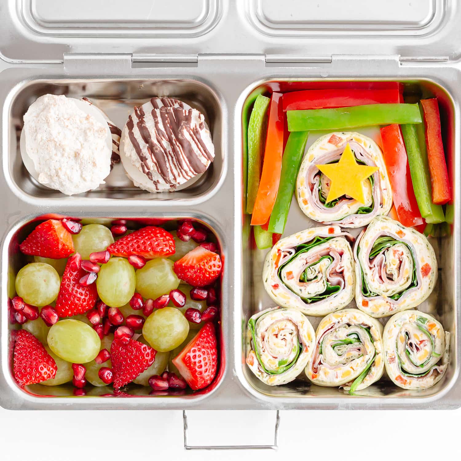 A Christmas themed lunch in a stainless steel bento box.