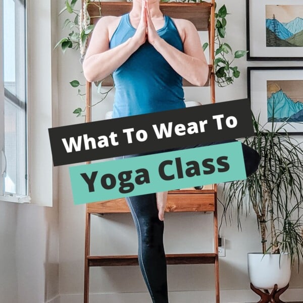 Woman standing in yoga tree pose with text overlay that reads "What To Wear To Yoga Class".