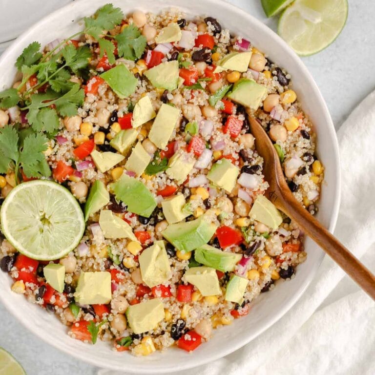 Southwest Quinoa Salad in a serving bowl with serving spoon.