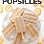 Banana popsicles piled on a bowl of ice with banana slices scattered around it and text overlay that reads "Banana Popsicles".