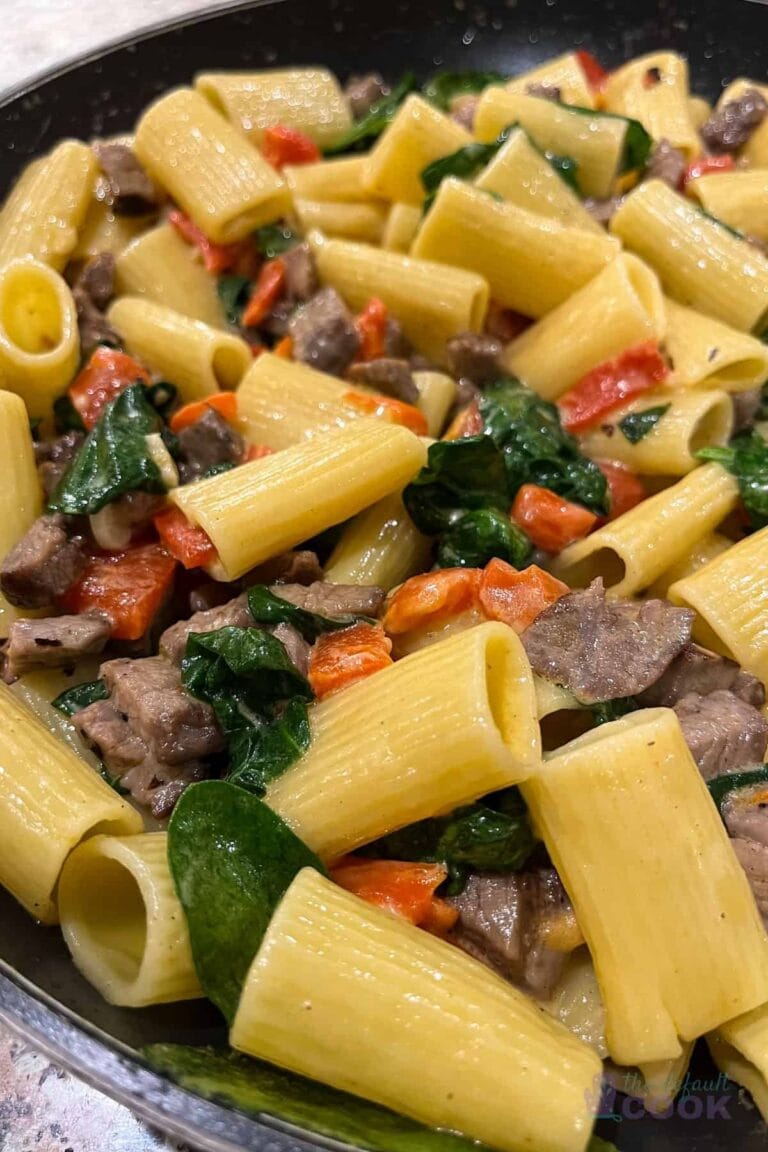 Rigatoni with sliced steak, roasted red peppers and spinach in a creamy sauce.