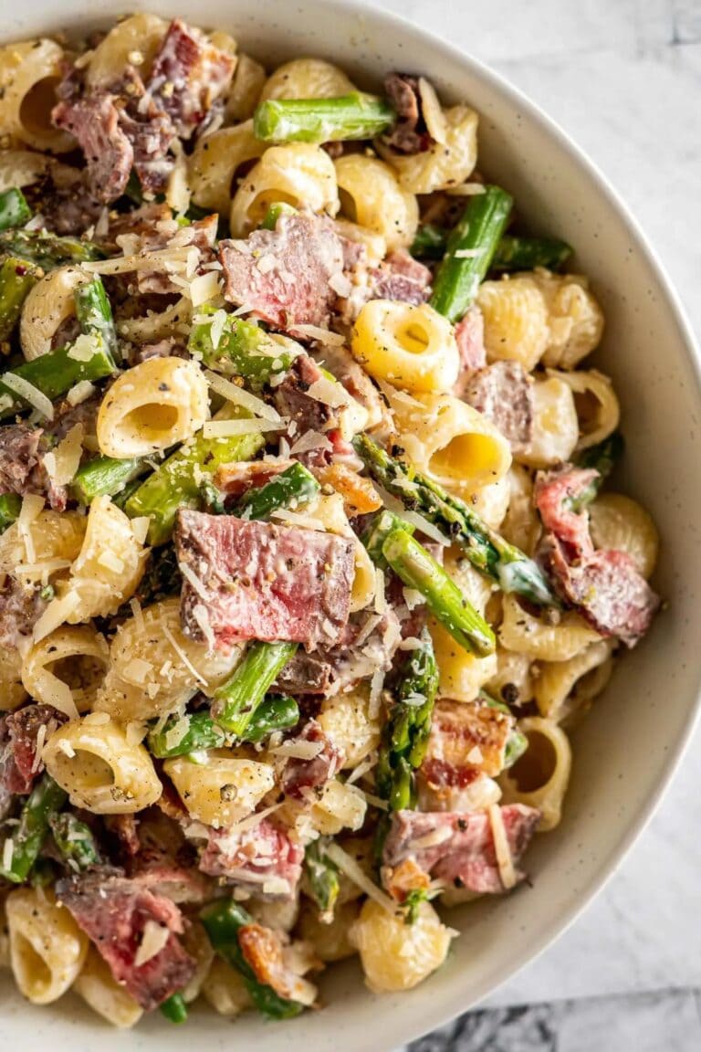 Steak pasta salad in large serving bowl.