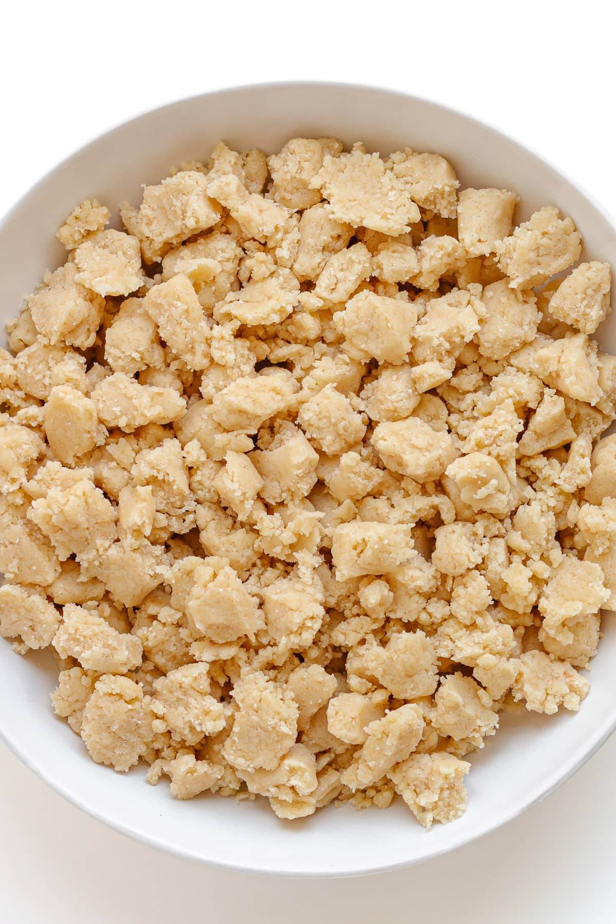 Unbaked German butter streusel topping in a white bowl.