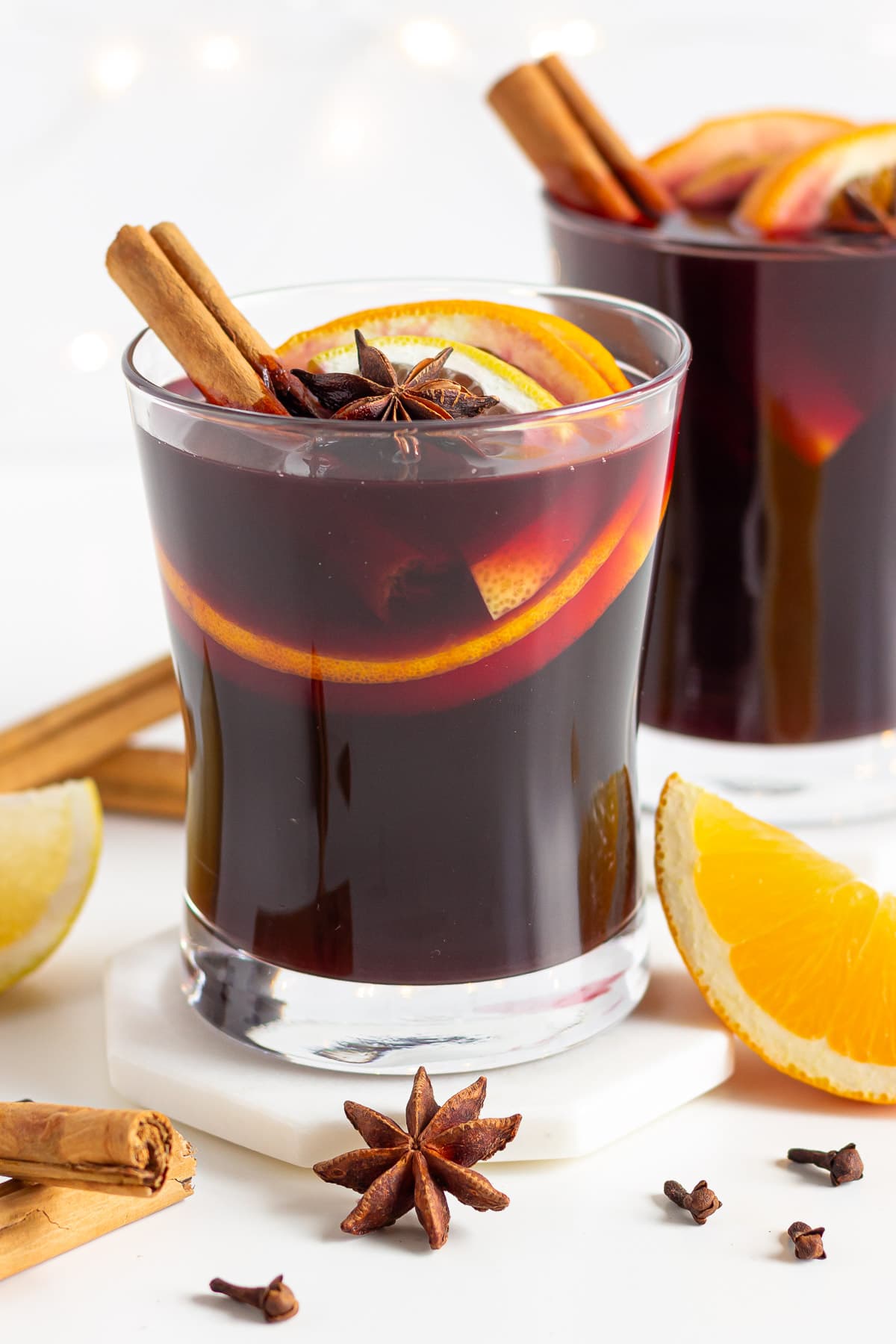 Two garnished glasses of Gluhwein.