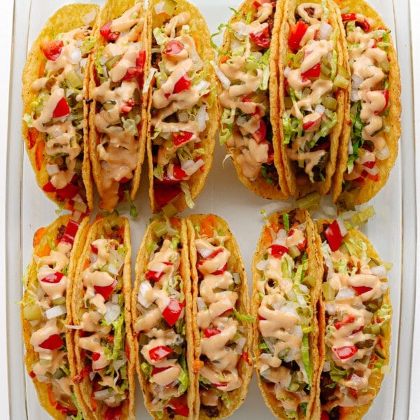 Baked cheeseburger tacos in a glass baking dish.