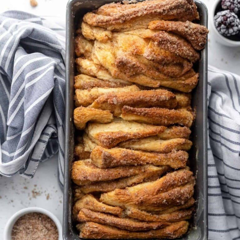 Cinnamon sugar pull apart bread in a loaf pan.