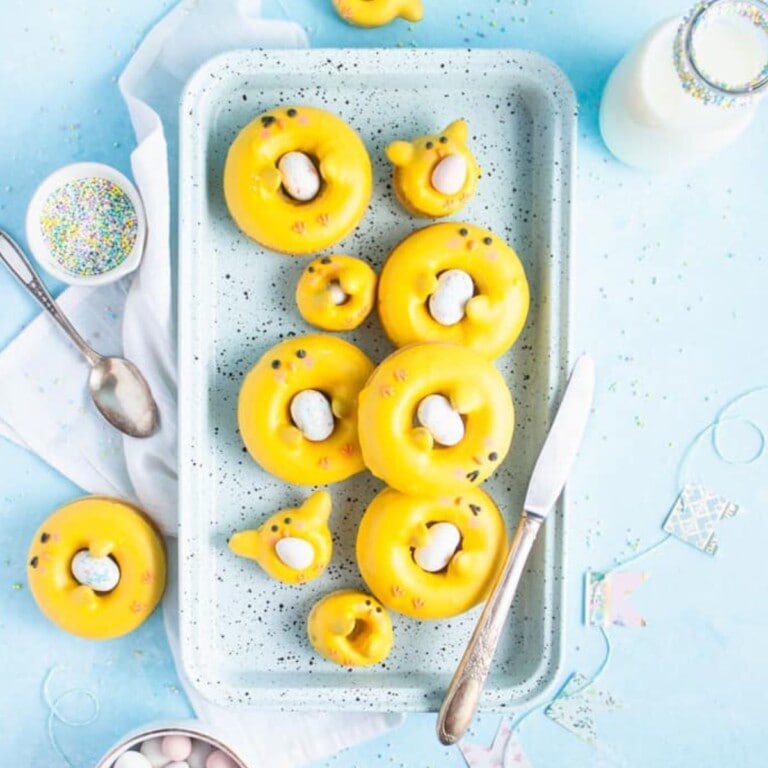 Platter of yellow doughnuts that look like Easter chicks.
