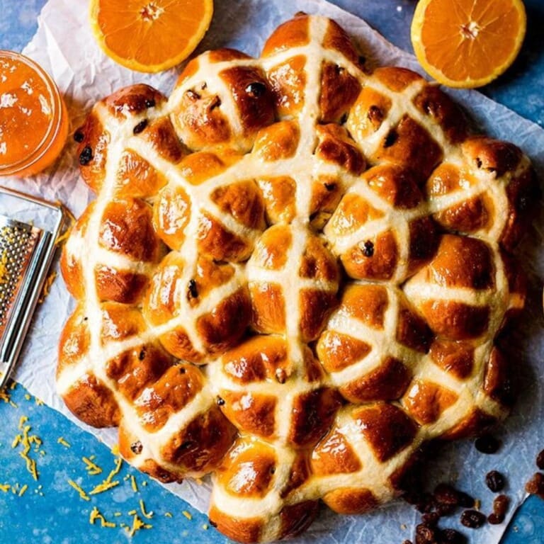 Hot cross buns with marmalade glaze.
