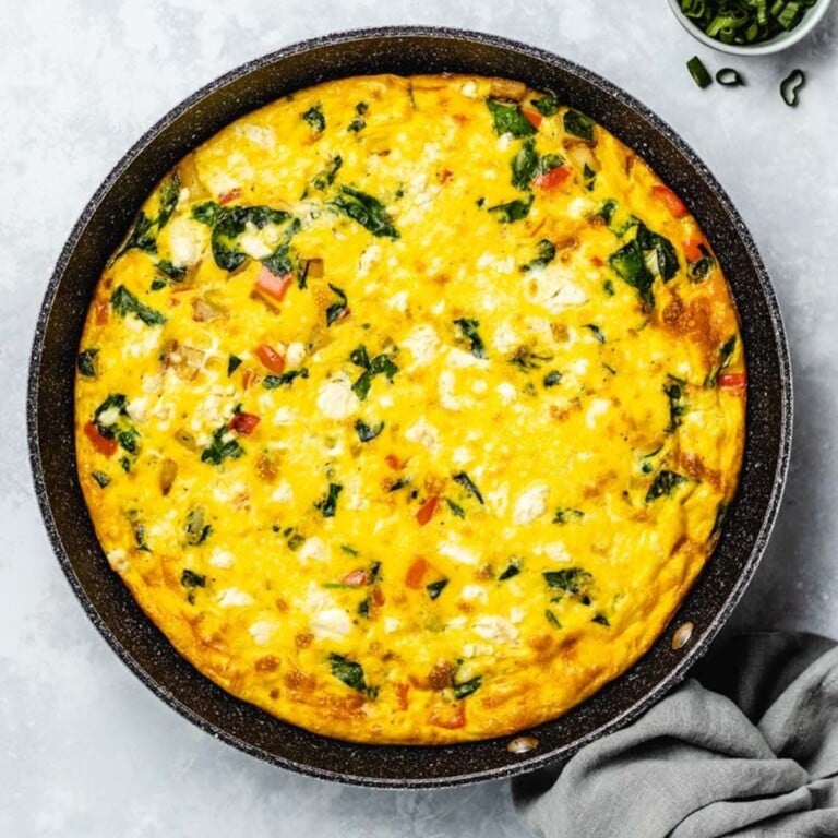 Potato and spinach frittata in a cast iron skillet.