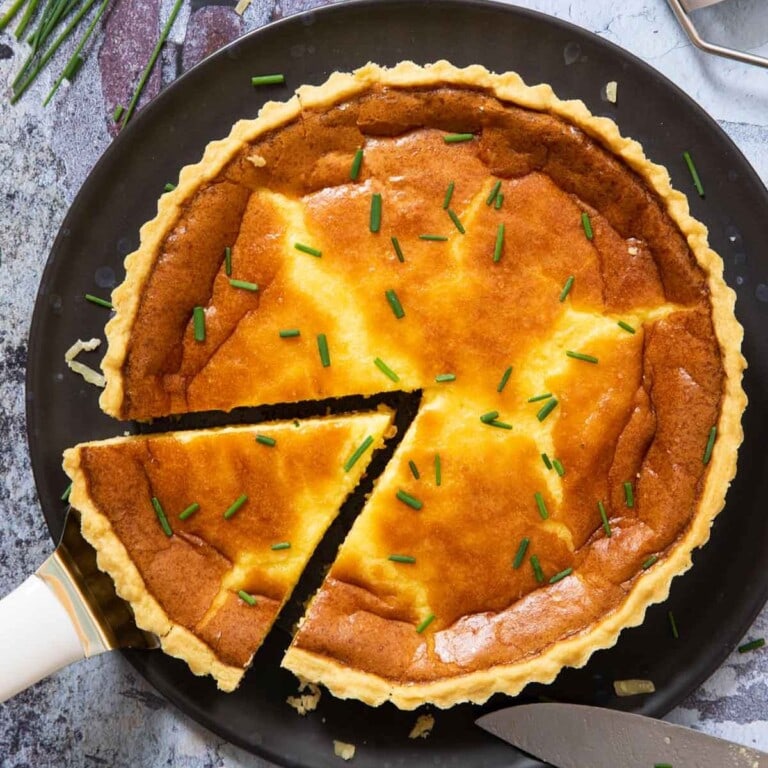 Swedish cheese pie with a slice cut out.