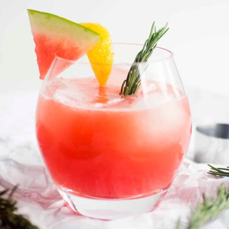 Glass of rosemary watermelon cocktail.