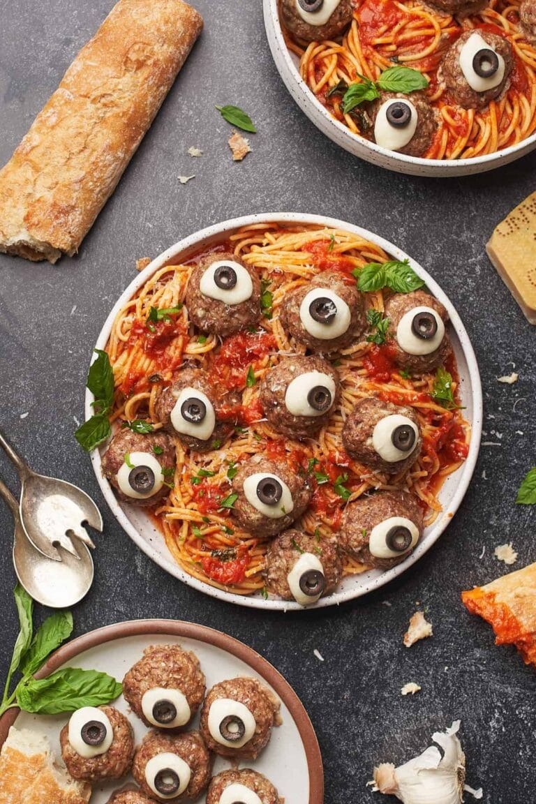Plate of spaghetti and meatballs decorated to look like eyeballs.