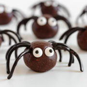 Halloween spider energy balls on a white surface.