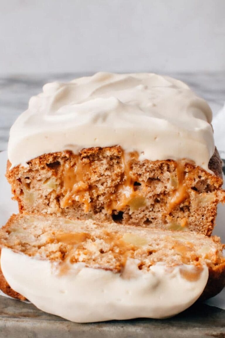 Caramel ripple apple cake with one slice cut.