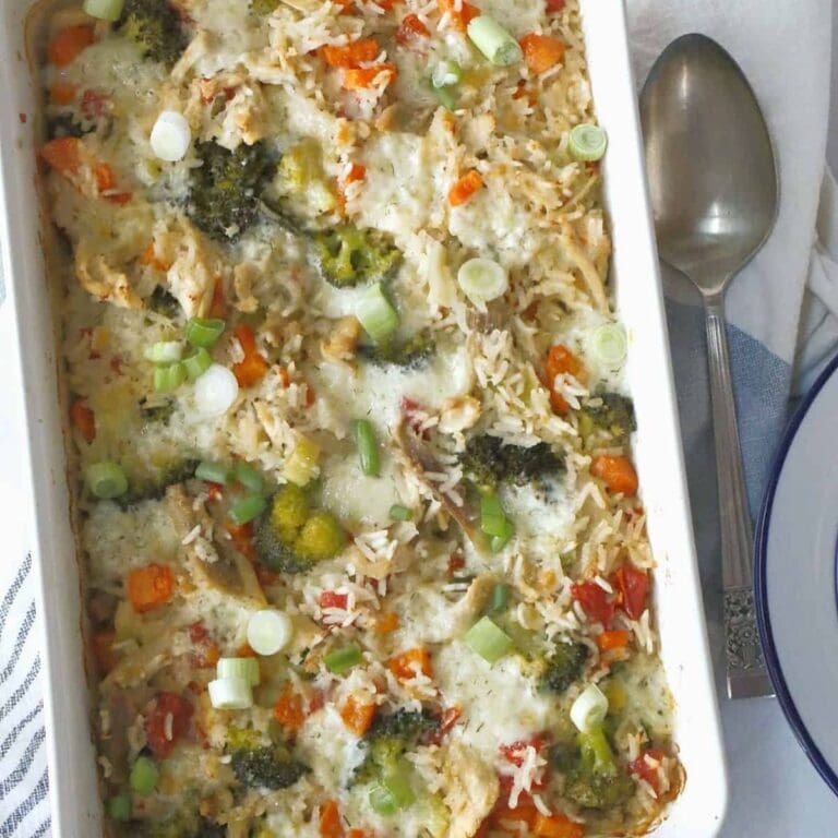 Turkey and rice casserole in white casserole dish.