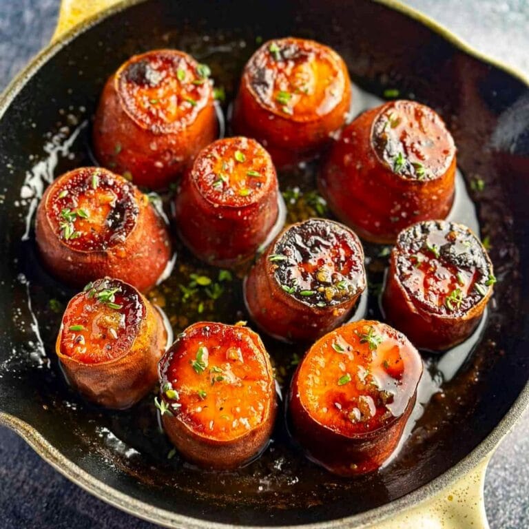 Fondant sweet potatoes in a cast iron skillet.
