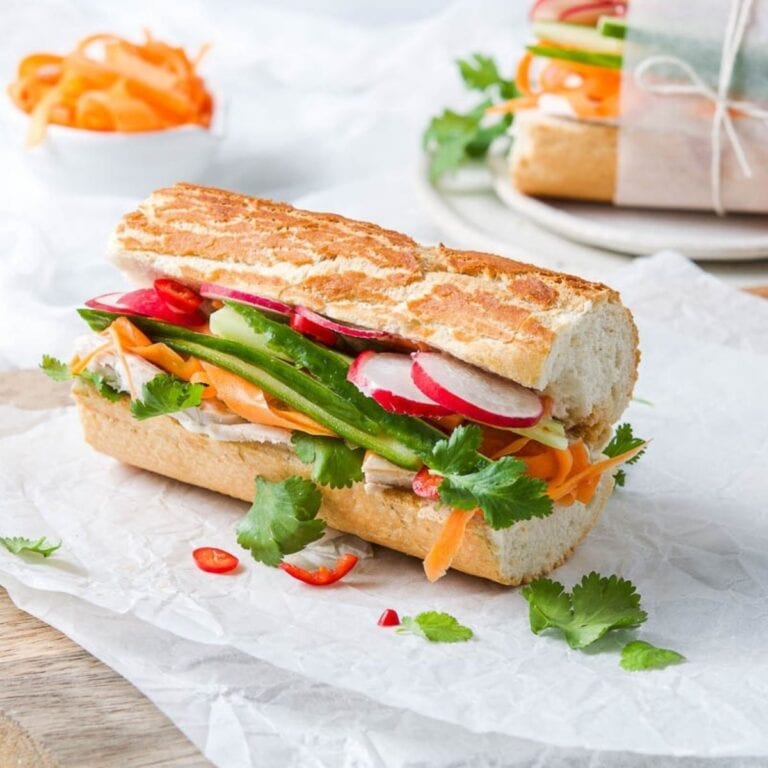 Turkey banh mi baguette on parchment paper.