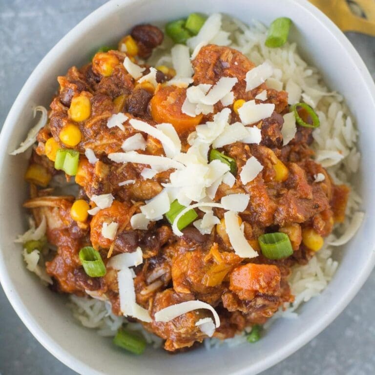 Leftover turkey chili in a white bowl.