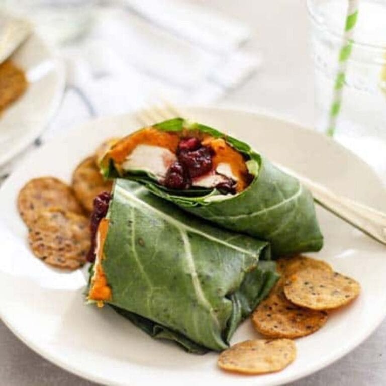 Turkey collard wraps on a white plate.