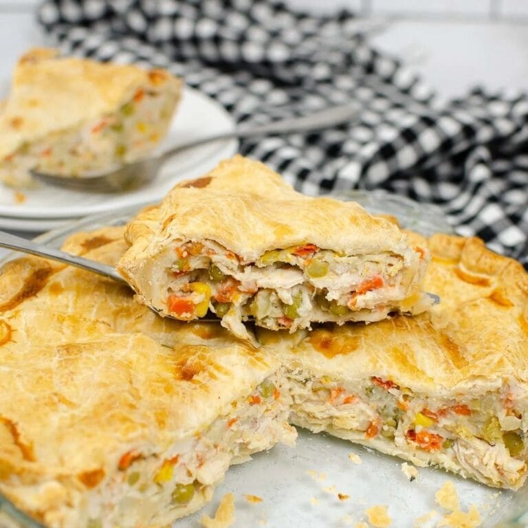 Leftover turkey pot pie with a slice lifted out.