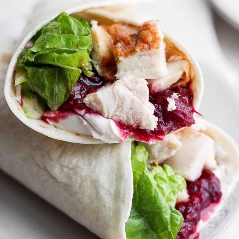 Two turkey cranberry wraps piled on top of each other.
