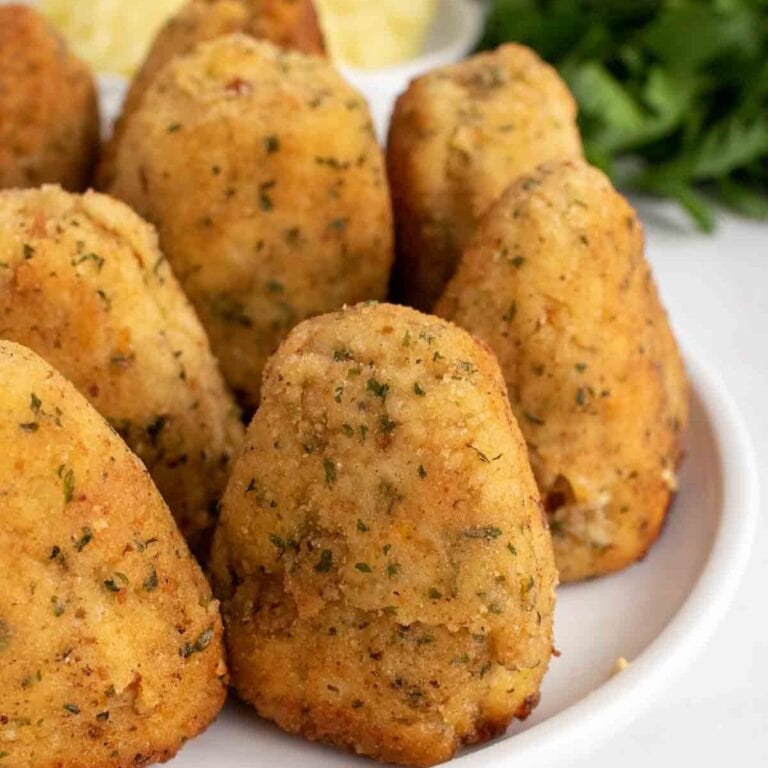 Turkey croquettes on a white plate.